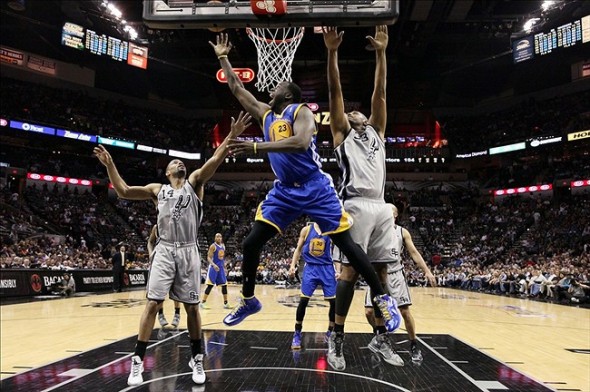 May 6, 2013; San Antonio, TX, USA; Golden State Warriors forward Draymond Green (23) drives to the basket past San Antonio Spurs forward Boris Diaw (33) during game one of the second round of the 2013 NBA Playoffs at the AT&T Center. The Spurs won 129-127 in overtime. Mandatory Credit: Soobum Im-USA TODAY Sports