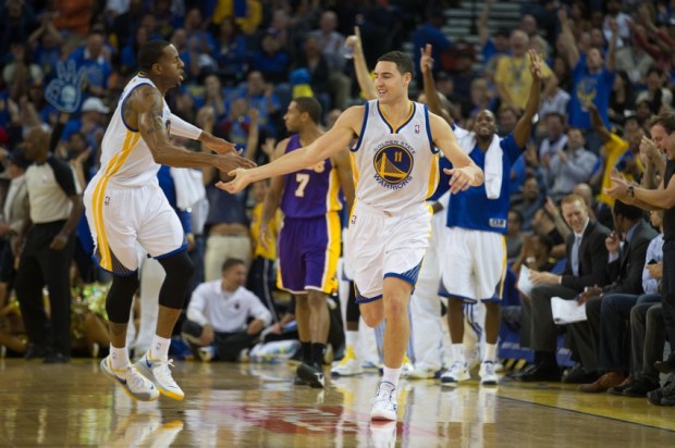 Oct 30, 2013; Oakland, CA, USA; Golden State Warriors shooting guard Klay Thompson (11) celebrates with shooting guard Andre Iguodala (9) after a basket against the Los Angeles Lakers during the second quarter at Oracle Arena. Mandatory Credit: Kelley L Cox-USA TODAY Sports