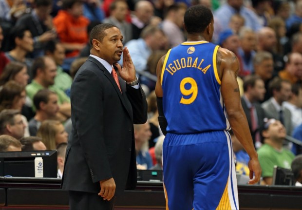 Nov 6, 2013; Minneapolis, MN, USA; Golden State Warriors head coach Mark Jackson talks to shooting guard Andre Iguodala (9) in the second half against the Minnesota Timberwolves at Target Center. The Warriors won 106-93. Mandatory Credit: Jesse Johnson-USA TODAY Sports