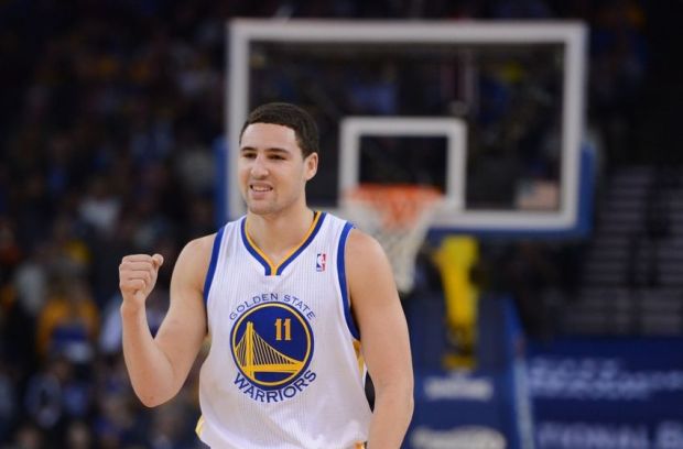 December 17, 2013; Oakland, CA, USA; Golden State Warriors shooting guard Klay Thompson (11) celebrates after a play against the New Orleans Pelicans during the first quarter at Oracle Arena. Mandatory Credit: Kyle Terada-USA TODAY Sports