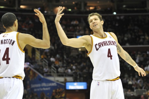 Feb 6, 2013; Cleveland, OH, USA; Cleveland Cavaliers small forward Luke Walton (4) and point guard Shaun Livingston (14) celebrate in the fourth quarter against the Charlotte Bobcats at Quicken Loans Arena. Mandatory Credit: David Richard-USA TODAY Sports