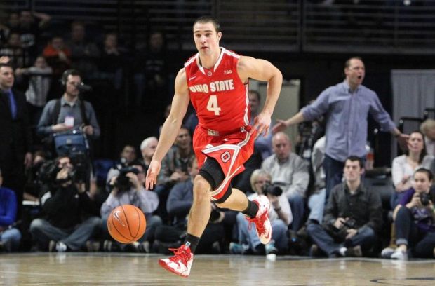 Feb 27, 2014; University Park, PA, USA; Ohio State Buckeyes guard Aaron Craft (4) dribbles the ball up court during the second half against the Penn State Nittany Lions at Bryce Jordan Center. Penn State defeated Ohio State 65-63. Mandatory Credit: Matthew O