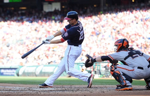 Aug 15, 2013; Washington, DC, USA; Washington Nationals first baseman Adam LaRoche (25) hits an RBI single during the third inning against the San Francisco Giants at Nationals Park. Mandatory Credit: Brad Mills-USA TODAY Sports