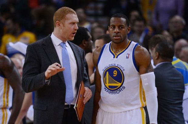 November 20, 2013; Oakland, CA, USA; Golden State Warriors assistant coach Brian Scalabrine (left) instructs small forward Andre Iguodala (9) during the fourth quarter against the Memphis Grizzlies at Oracle Arena. The Grizzlies defeated the Warriors 88-81 in overtime. Mandatory Credit: Kyle Terada-USA TODAY Sports