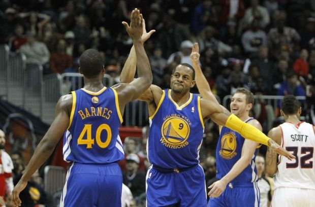 Jan 3, 2014; Atlanta, GA, USA; Golden State Warriors small forward Harrison Barnes (40) shows emotion with small forward Andre Iguodala (9) against the Atlanta Hawks in the fourth quarter at Philips Arena. The Warriors defeated the Hawks 101-100. Mandatory Credit: Brett Davis-USA TODAY Sports