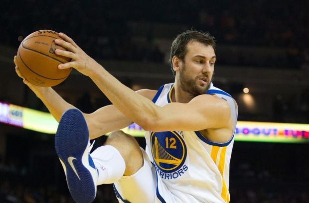 Mar 14, 2014; Oakland, CA, USA; Golden State Warriors center Andrew Bogut (12) controls a rebound against the Cleveland Cavaliers during the second quarter at Oracle Arena. Mandatory Credit: Kelley L Cox-USA TODAY Sports