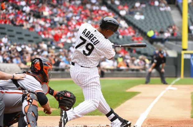 Jun 18, 2014; Chicago, IL, USA; Chicago White Sox first baseman Jose Abreu (79) hits a two run home run against San Francisco Giants starting pitcher Tim Hudson (not pictured) during the first inning at U.S Cellular Field. Mandatory Credit: Mike DiNovo-USA TODAY Sports