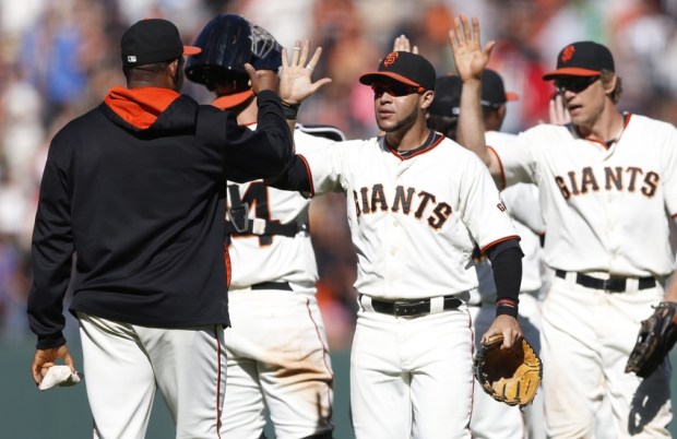 Aug 31, 2014; San Francisco, CA, USA; San Francisco Giants outfield comes in to celebrate with rest of team after the final out of the game against the Milwaukee Brewers at AT&T Park. Giants won 15 to 5. Mandatory Credit: Bob Stanton-USA TODAY Sports