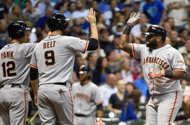 Aug 5, 2014; Milwaukee, WI, USA; San Francisco Giants third baseman Pablo Sandoval (48) celebrates with second baseman Joe Panik (12) and right fielder Hunter Pence (8) after hitting a 3-run homer in the sixth inning against the Milwaukee Brewers at Miller Park. Mandatory Credit: Benny Sieu-USA TODAY Sports