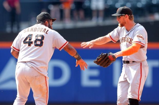 Aug 4, 2014; New York, NY, USA; San Francisco Giants third baseman Pablo Sandoval (48) celebrates with right fielder Hunter Pence (8) after defeating the New York Mets after the ninth inning of a game at Citi Field. Mandatory Credit: Brad Penner-USA TODAY Sports