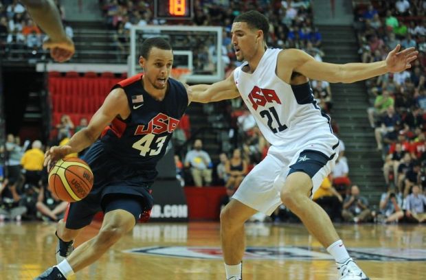 Aug 1, 2014; Las Vegas, NV, USA; USA Team Blue guard Stephen Curry (43) dribbles the ball into the lane against the defense of USA Team White guard Klay Thompson (21) during the USA Basketball Showcase at Thomas & Mack Center. Mandatory Credit: Stephen R. Sylvanie-USA TODAY Sports