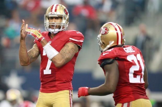 Sep 7, 2014; Arlington, TX, USA; San Francisco 49ers quarterback Colin Kaepernick (7) in game action against the Dallas Cowboys at AT&T Stadium. San Francisco beat Dallas 28-17. Mandatory Credit: Tim Heitman-USA TODAY Sports