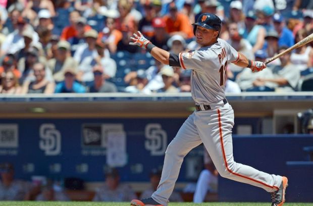 Jul 6, 2014; San Diego, CA, USA; San Francisco Giants shortstop Joe Panik (12) hits an RBI double during the third inning against the San Diego Padres at Petco Park. Mandatory Credit: Jake Roth-USA TODAY Sports