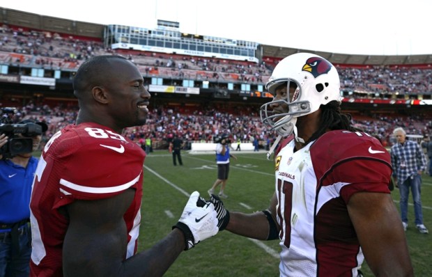 Oct 13, 2013; San Francisco, CA, USA; Arizona Cardinals wide receiver Larry Fitzgerald (11) and San Francisco 49ers tight end Vernon Davis (85) talk after the game on the field at Candlestick Park. San Francisco 49ers won 32-20.  Mandatory Credit: Bob Stanton-USA TODAY Sports