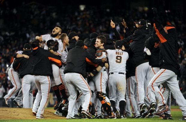 Oct 28, 2012; Detroit, MI, USA; Members of the San Francisco Giants celebrate on the field after game four of the 2012 World Series against the Detroit Tigers at Comerica Park. The Giants won 4-3 to sweep the series. Mandatory Credit: H. Darr Beiser-USA TODAY Sports