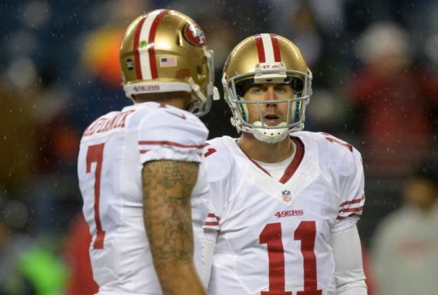 Dec 23, 2012; Seattle, WA, USA; San Francisco 49ers quarterbacks Alex Smith (11) and Colin Kaepernick (7) react against the Seattle Seahawks at CenturyLink Field. Mandatory Credit: Kirby Lee/Image of Sport-USA TODAY Sports