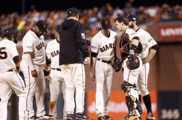 Oct 24, 2014; San Francisco, CA, USA; San Francisco Giants starting pitcher Tim Hudson (middle) is relieved by manager Bruce Bochy (in black) in the sixth inning against the Kansas City Royals during game three of the 2014 World Series at AT&T Park. Mandatory Credit: Kelley L Cox-USA TODAY Sports