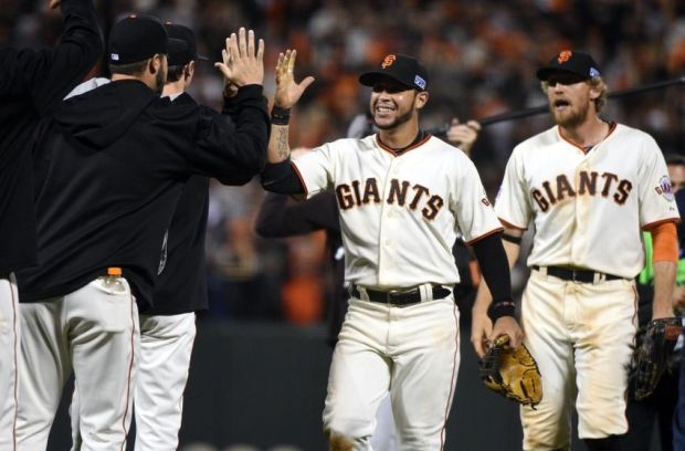 Oct 15, 2014; San Francisco, CA, USA; San Francisco Giants center fielder Gregor Blanco (7) celebrates after beating the St. Louis Cardinals in game four of the 2014 NLCS playoff baseball game at AT&T Park. Mandatory Credit: Kyle Terada-USA TODAY Sports