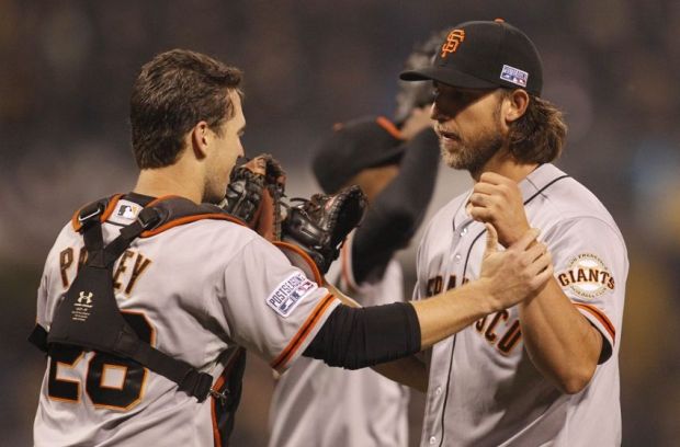 Oct 1, 2014; Pittsburgh, PA, USA; San Francisco Giants starting pitcher Madison Bumgarner (40) celebrates with catcher Buster Posey (28) after defeating the Pittsburgh Pirates in the 2014 National League Wild Card playoff baseball game at PNC Park. The Giants won 8-0. Mandatory Credit: Charles LeClaire-USA TODAY Sports