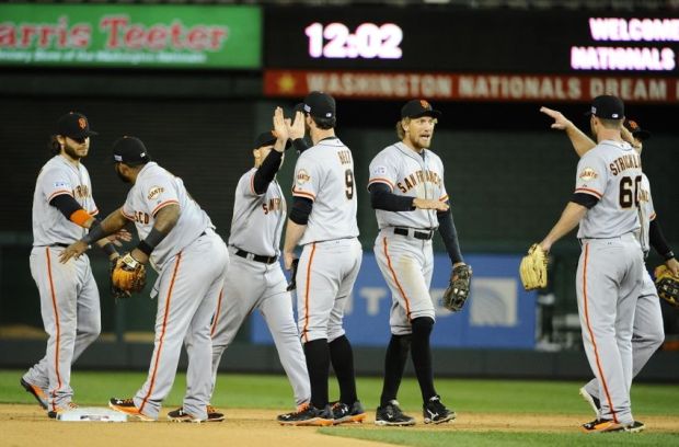 Oct 4, 2014; Washington, DC, USA; San Francisco Giants celebrate after winning 2-1 against the Washington Nationals in 18 innings in game two of the 2014 NLDS playoff baseball game at Nationals Park. Mandatory Credit: Brad Mills-USA TODAY Sports