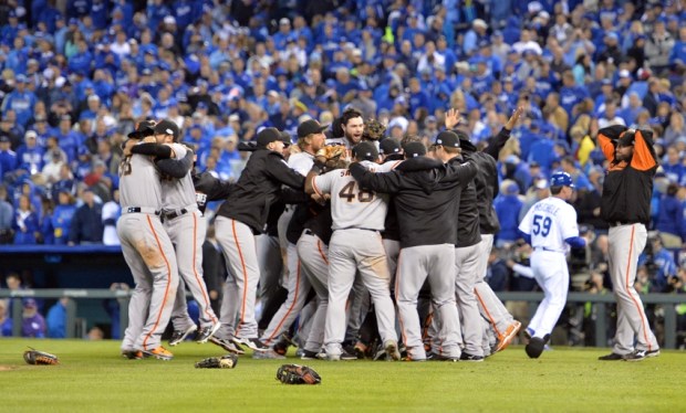 Oct 29, 2014; Kansas City, MO, USA; San Francisco Giants players celebrate on the field after defeating the Kansas City Royals in game seven of the 2014 World Series at Kauffman Stadium. Mandatory Credit: Peter G. Aiken-USA TODAY Sports