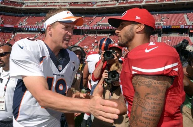 Aug 17, 2014; Santa Clara, CA, USA; Denver Broncos quarterback Peyton Manning (18) and San Francisco 49ers quarterback Colin Kaepernick (7) shake hands after the inaugural football game at Levi's Stadium. The Broncos defeated the 49ers 34-0. Mandatory Credit: Kirby Lee-USA TODAY Sports