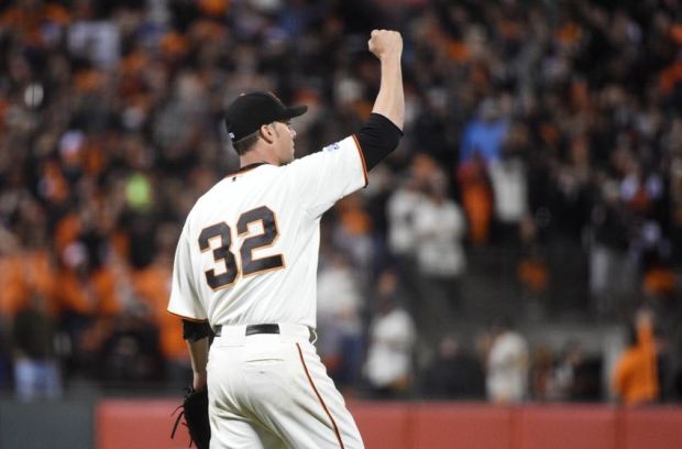 Oct 7, 2014; San Francisco, CA, USA; San Francisco Giants starting pitcher Ryan Vogelsong reacts after a catch by right fielder Hunter Pence (not pictured) in the sixth inning during game four of the 2014 NLDS baseball playoff game against the Washington Nationals at AT&T Park. Mandatory Credit: Kyle Terada-USA TODAY Sports