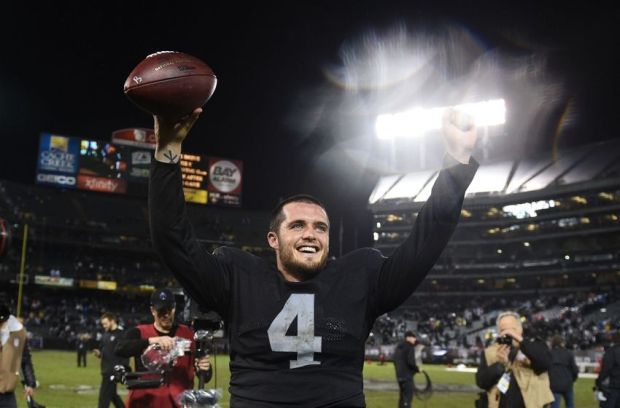 November 20, 2014; Oakland, CA, USA; Oakland Raiders quarterback Derek Carr (4) celebrates after the game against the Kansas City Chiefs at O.co Coliseum. The Raiders defeated the Chiefs 24-20. Mandatory Credit: Kyle Terada-USA TODAY Sports