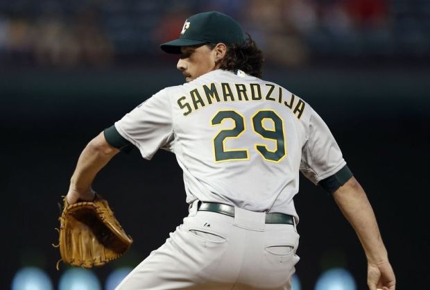Sep 27, 2014; Arlington, TX, USA; Oakland Athletics starting pitcher Jeff Samardzija (29) delivers to the Texas Rangers during a baseball game at Globe Life Park in Arlington. Mandatory Credit: Jim Cowsert-USA TODAY Sports