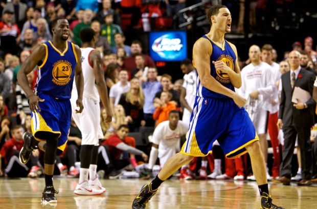 Nov 2, 2014; Portland, OR, USA; Golden State Warriors guard Klay Thompson (11) reacts after making the game winning shot against the Portland Trail Blazers during the fourth quarter at the Moda Center. Mandatory Credit: Craig Mitchelldyer-USA TODAY Sports