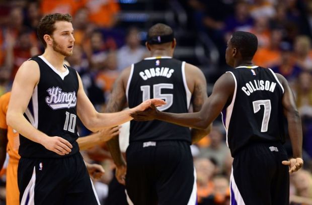 Nov 7, 2014; Phoenix, AZ, USA; Sacramento Kings guard Nik Stauskas (10) and guard Darren Collison (7) high five in the second half while playing against the Phoenix Suns at US Airways Center. The Kings won 114-112 in double overtime. Mandatory Credit: Jennifer Stewart-USA TODAY Sports