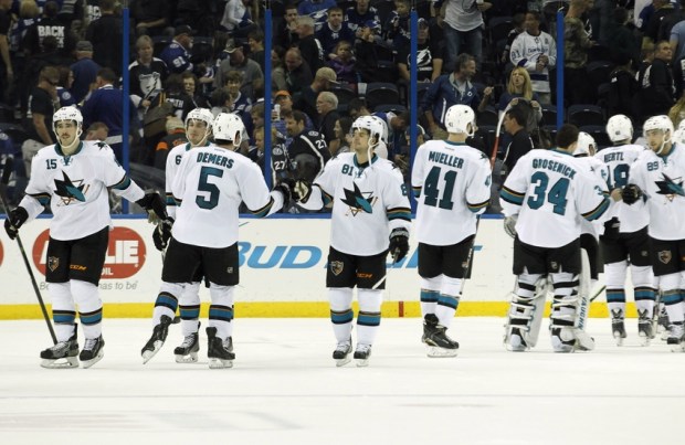 Nov 13, 2014; Tampa, FL, USA; San Jose Sharks center Tyler Kennedy (81) and teammates congratulate each other after they beat the Tampa Bay Lightning during the third period at Amalie Arena. San Jose Sharks defeated the Tampa Bay Lightning 2-1. Mandatory Credit: Kim Klement-USA TODAY Sports