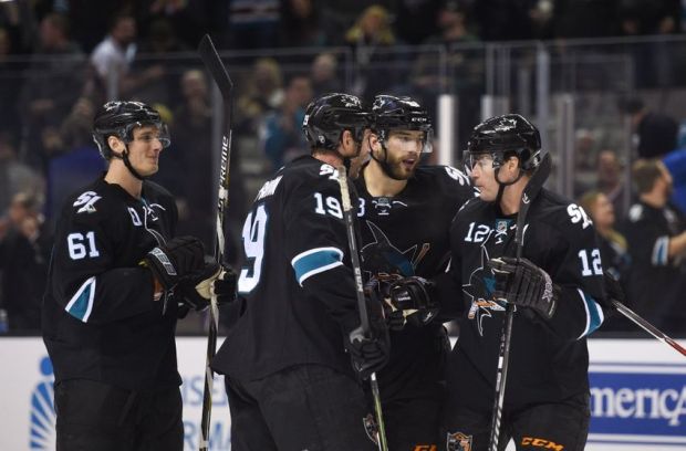 December 11, 2014; San Jose, CA, USA; San Jose Sharks defenseman Brent Burns (88) is congratulated for scoring a goal against the Minnesota Wild during the second period at SAP Center at San Jose. Mandatory Credit: Kyle Terada-USA TODAY Sports