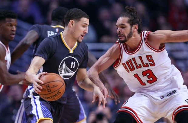 Dec 6, 2014; Chicago, IL, USA; Golden State Warriors guard Klay Thompson (11) drives on Chicago Bulls center Joakim Noah (13) during the first quarter at the United Center. Mandatory Credit: Dennis Wierzbicki-USA TODAY Sports