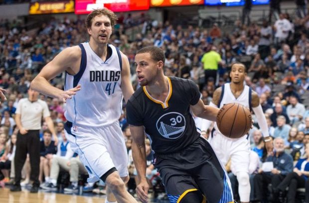 Dec 13, 2014; Dallas, TX, USA; Golden State Warriors guard Stephen Curry (30) dribbles the ball past Dallas Mavericks forward Dirk Nowitzki (41) during the second half at the American Airlines Center. The Warriors defeated the Mavericks 105-98. Mandatory Credit: Jerome Miron-USA TODAY Sports