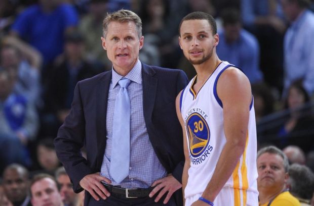 December 2, 2014; Oakland, CA, USA; Golden State Warriors head coach Steve Kerr (left) talks to guard Stephen Curry (30) during the fourth quarter against the Orlando Magic at Oracle Arena. The Warriors defeated the Magic 98-97. Mandatory Credit: Kyle Terada-USA TODAY Sports