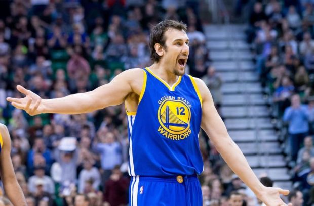 Jan 30, 2015; Salt Lake City, UT, USA; Golden State Warriors center Andrew Bogut (12) reacts while walking to the bench during a time out in the second half against the Utah Jazz at EnergySolutions Arena. The Jazz won 110-100. Mandatory Credit: Russ Isabella-USA TODAY Sports