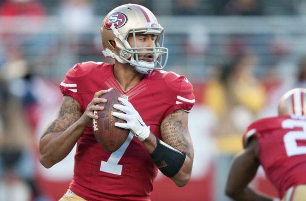 Dec 28, 2014; Santa Clara, CA, USA; San Francisco 49ers quarterback Colin Kaepernick (7) drops back for a pass against the Arizona Cardinals during the third quarter at Levi's Stadium. The against the San Francisco 49ers defeated the Arizona Cardinals 20-17. Mandatory Credit: Ed Szczepanski-USA TODAY Sports