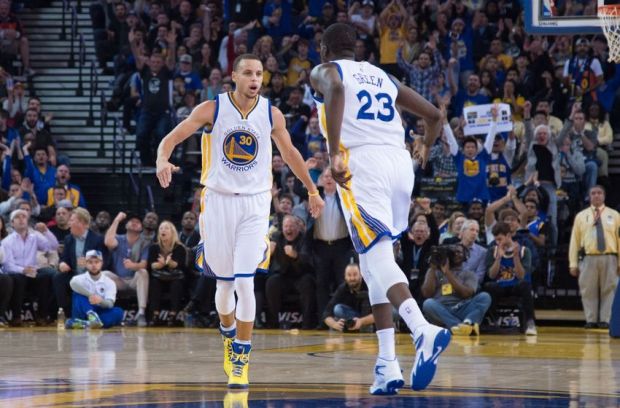 January 7, 2015; Oakland, CA, USA; Golden State Warriors guard Stephen Curry (30) celebrates with forward Draymond Green (23) against the Indiana Pacers during the second quarter at Oracle Arena. Mandatory Credit: Kyle Terada-USA TODAY Sports