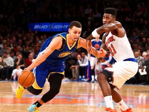 Feb. 27, 2013; New York, NY, USA; Golden State Warriors point guard Stephen Curry (30) drives to the net around New York Knicks point guard Iman Shumpert (21) during the second quarter at Madison Square Garden. Mandatory Credit: Debby Wong-USA TODAY Sports