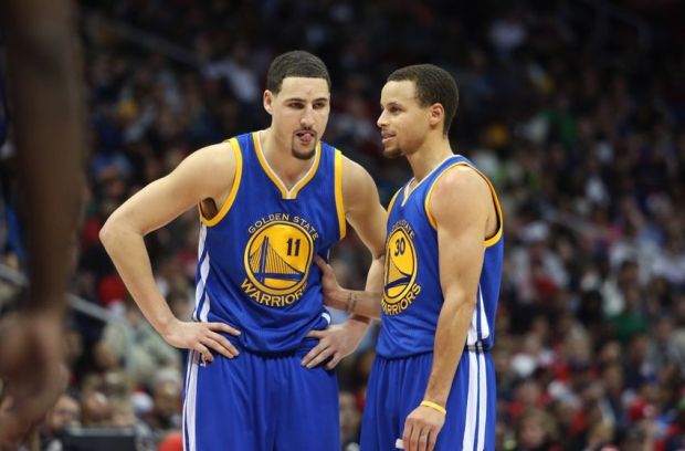 Feb 6, 2015; Atlanta, GA, USA; Golden State Warriors guard Klay Thompson (11) and guard Stephen Curry (30) talk in the third quarter of their game against the Atlanta Hawks at Philips Arena. The Hawks won 124-116. Mandatory Credit: Jason Getz-USA TODAY Sports