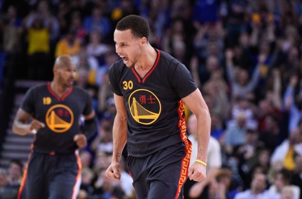 February 20, 2015; Oakland, CA, USA; Golden State Warriors guard Stephen Curry (30) celebrates against the San Antonio Spurs during the third quarter at Oracle Arena. The Warriors defeated the Spurs 110-99. Mandatory Credit: Kyle Terada-USA TODAY Sports