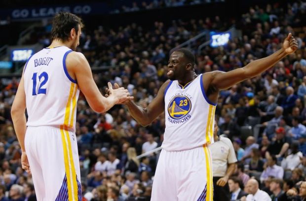 Feb 27, 2015; Toronto, Ontario, CAN; Golden State Warriors forward Draymond Green (23) and center Andrew Bogut (12) celebrate against the Toronto Raptors at the Air Canada Centre. Golden State defeated Toronto 113-89. Mandatory Credit: John E. Sokolowski-USA TODAY Sports