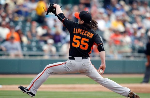 Mar 3, 2015; Mesa, AZ, USA; San Francisco Giants starting pitcher Tim Lincecum (55) throws in the third inning against the Oakland Athletics at HoHoKam Stadium. Mandatory Credit: Rick Scuteri-USA TODAY Sports