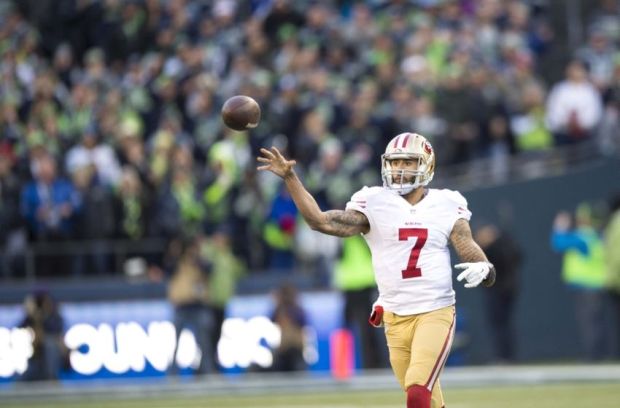 Dec 14, 2014; Seattle, WA, USA; San Francisco 49ers quarterback Colin Kaepernick (7) passes the ball against the Seattle Seahawks during the second half at CenturyLink Field. Seattle defeated San Francisco 17-7. Mandatory Credit: Steven Bisig-USA TODAY Sports