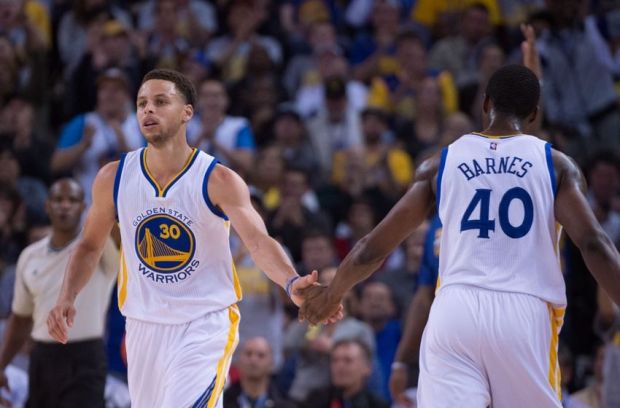 April 9, 2015; Oakland, CA, USA; Golden State Warriors guard Stephen Curry (30) celebrates with forward Harrison Barnes (40) against the Portland Trail Blazers during the first quarter at Oracle Arena. Mandatory Credit: Kyle Terada-USA TODAY Sports