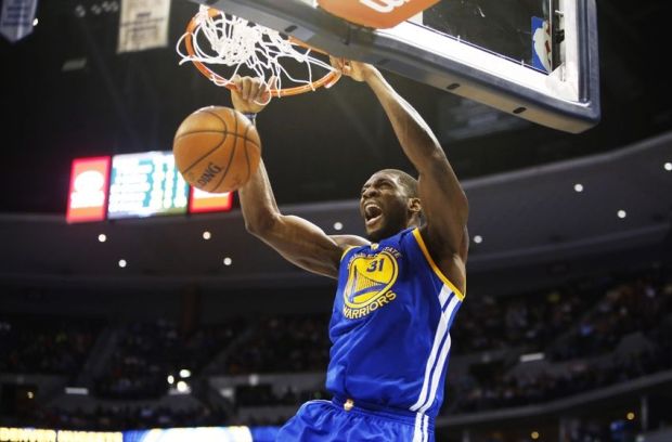 Mar 13, 2015; Denver, CO, USA; Golden State Warriors center Festus Ezeli (31) dunks the ball during the second half against the Denver Nuggets at Pepsi Center. The Nuggets won 114-103. Mandatory Credit: Chris Humphreys-USA TODAY Sports
