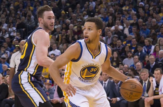 December 23, 2015; Oakland, CA, USA; Golden State Warriors guard Stephen Curry (30) dribbles the basketball against Utah Jazz forward Gordon Hayward (20, left) during the second quarter at Oracle Arena. Mandatory Credit: Kyle Terada-USA TODAY Sports