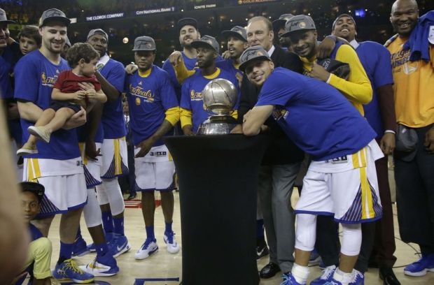 May 30, 2016; Oakland, CA, USA; Golden State Warriors guard Stephen Curry, center, and teammates celebrate after game seven of the Western conference finals of the NBA Playoffs against the Oklahoma City Thunder at Oracle Arena. The Warriors defeated the Thunder 96-88. Mandatory Credit: Marcio Jose Sanchez-Pool Photo via USA TODAY Sports